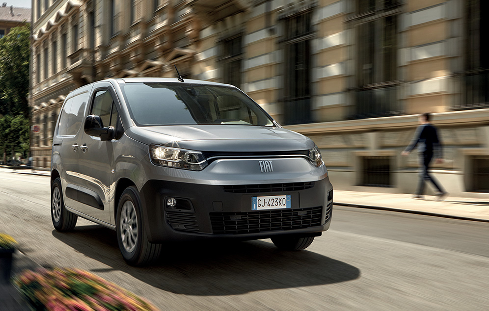 Fiat E-Doblo Cargo on the road with background motion blur