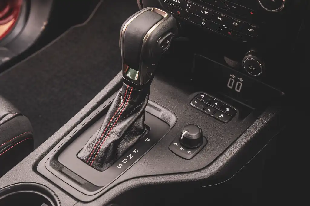 Gear selector with red stitching