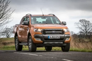 Ford Ranger (2015-2022) in burnt orange metallic paint on the road