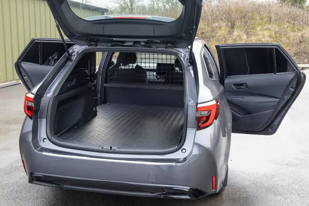The Toyota Corrola Commercial Hybrid rear loadspace area with the boot and rear doors open