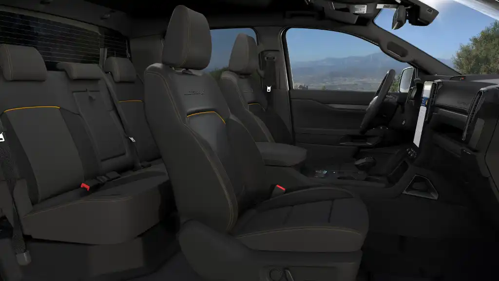 Wildtrak X interior view of five seats with orange stitching details