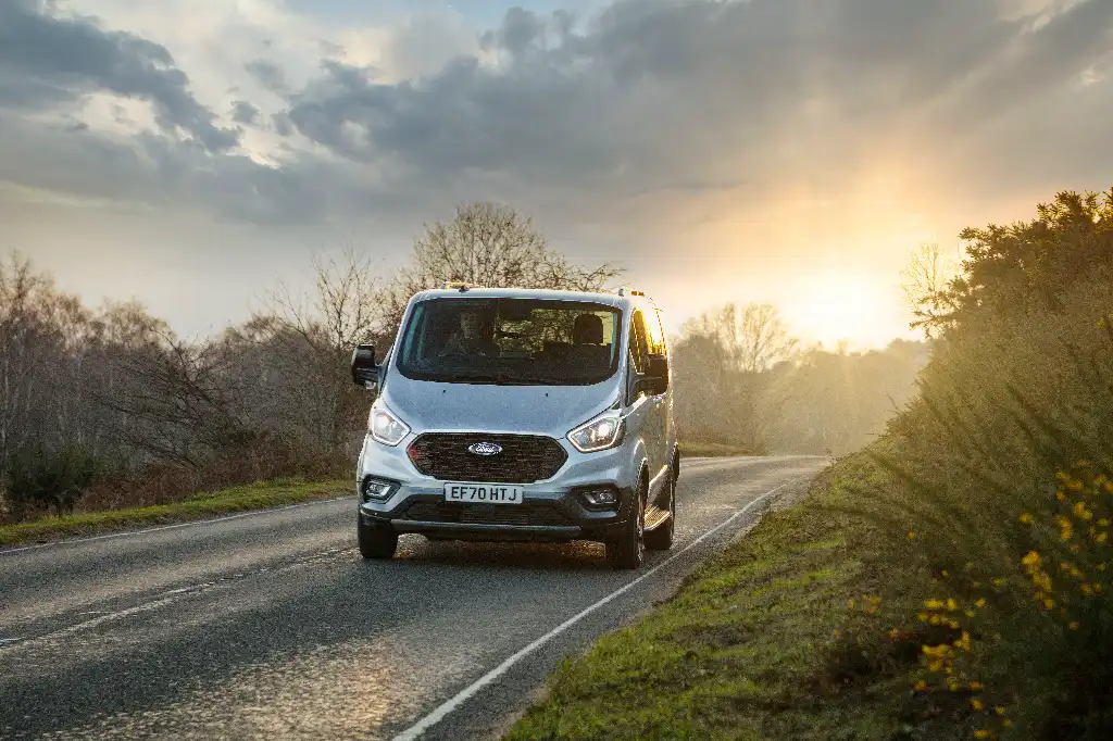 Ford Transit Custom Active on the road with the sunset behind