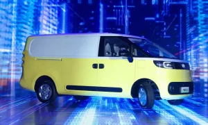 Maxus eDeliver 5 at the launch in Najing on a stage with blue LED light background and white and yellow two-tone paint