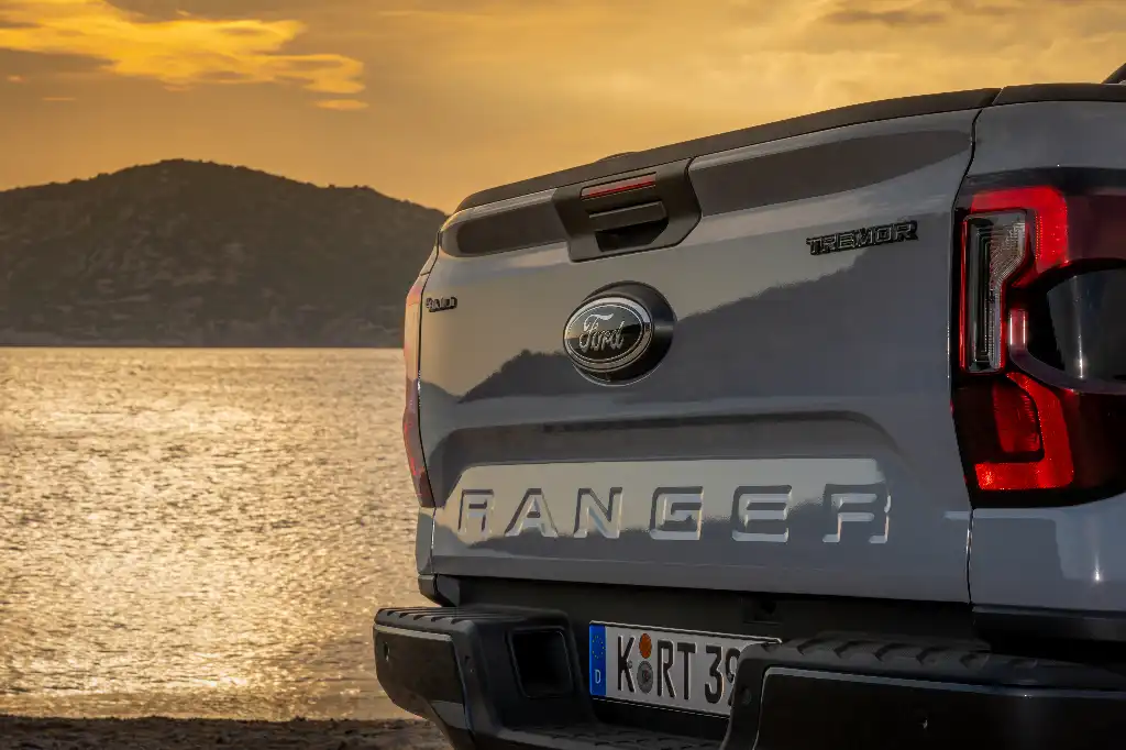 Rear tailgate of the Ford Ranger Tremor with a sunset background and the sea