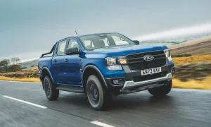 Ford Ranger Tremor pick-up truck driving on a damp road 2023 model with 73-plate