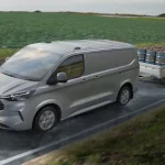 Ford Transit Custom towing a trailer with beer kegs