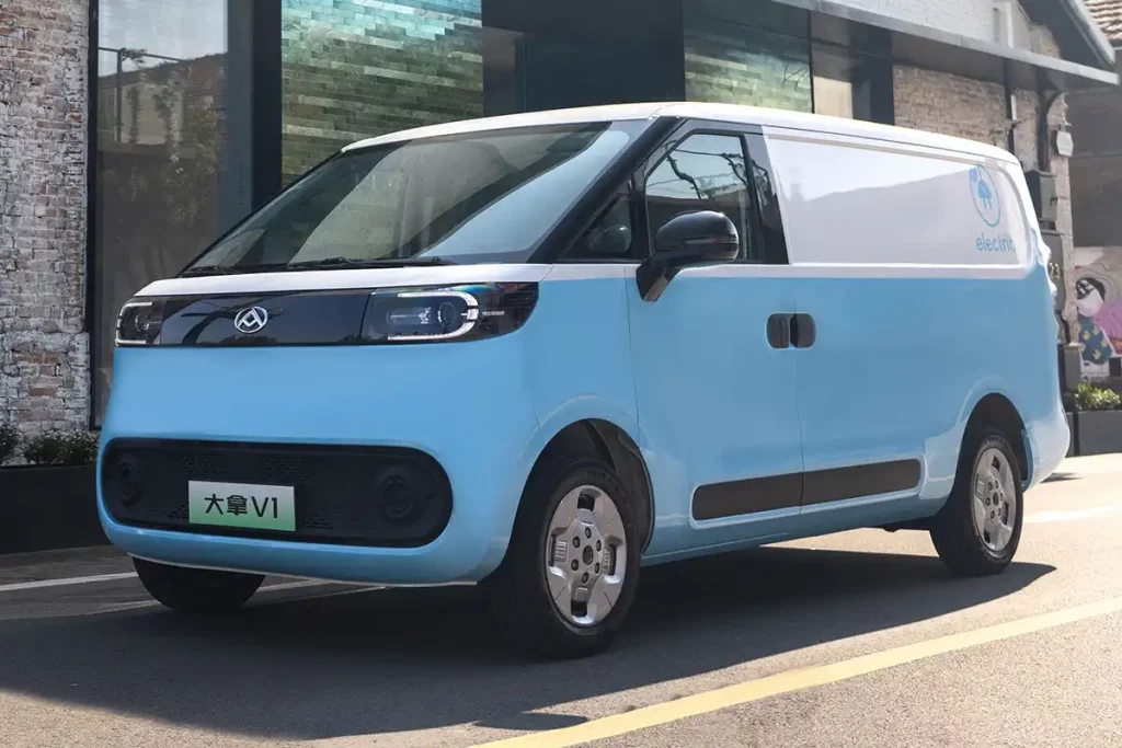 Maxus E Deliver 5 in blue and white parked on a street to show its dimensions
