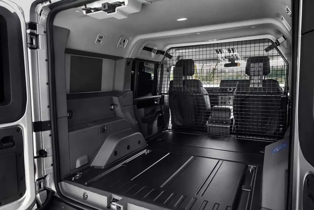 Rear loadspace with flat floor and steel mesh grille in Ineos Grenadier Commercial