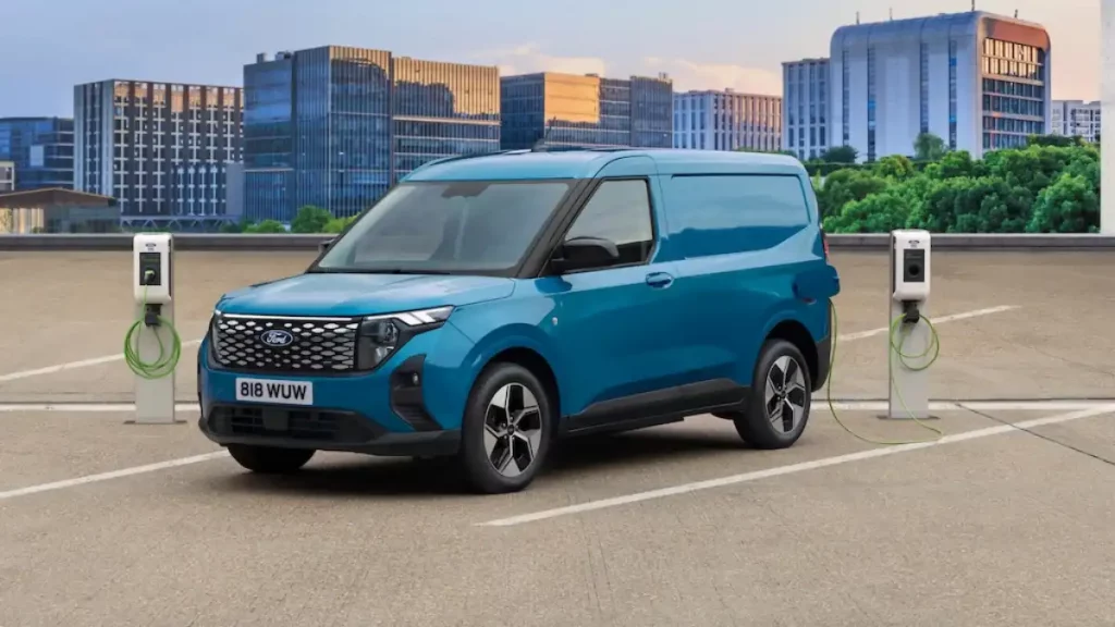 Ford E-Transit Courier next to chargers