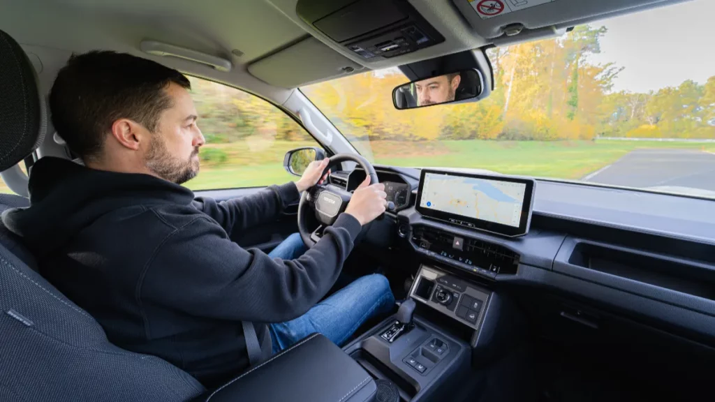 George Barrow driving electric Hilux