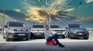 New vans with George Barrow on a toy bike and fireworks