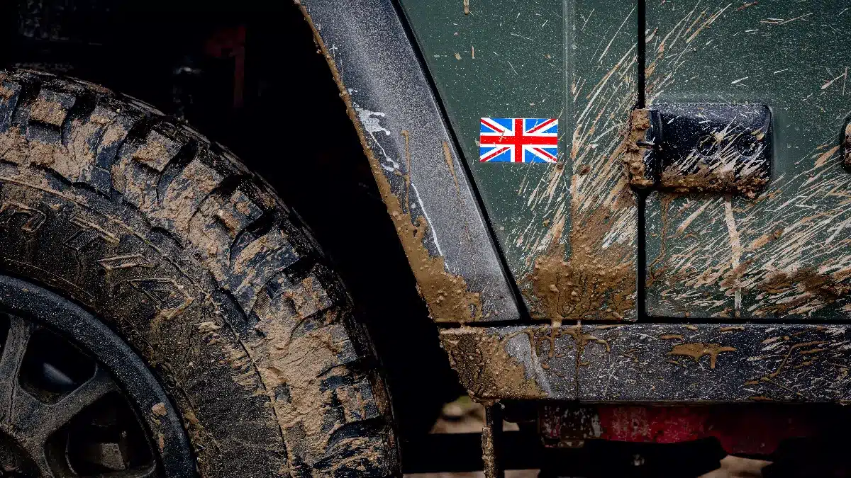 tyre with british flag on the side of a Ineos Grenadier military vehicle